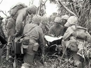 A company of American Marines are briefed during the Battle of Iwo Jima, 20 February 1945