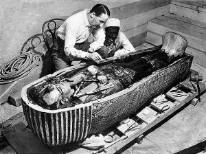 Howard Carter studies Tutankhamun's sarcophagus, 1922 